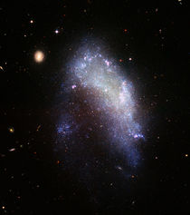 Irregular galaxy NGC 1427A. by Stocktrek Images