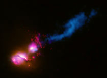A powerful jet from a supermassive black hole. by Stocktrek Images