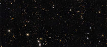 A panoramic view of over 7,500 galaxies. by Stocktrek Images