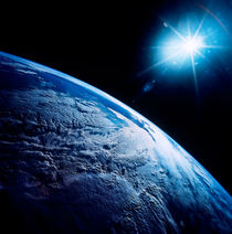Shining star over Earth. von Stocktrek Images