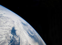 Earth's horizon and the blackness of space. by Stocktrek Images
