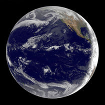 Earth centered over the Pacific Ocean. by Stocktrek Images
