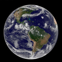 Full Earth showing various tropical storm systems. by Stocktrek Images