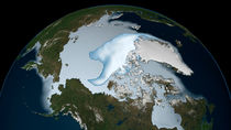 Planet Earth showing sea ice coverage in 2012. by Stocktrek Images