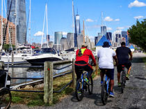 Three Bicyclists By Liberty Landing Marina by Susan Savad
