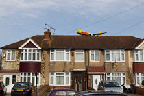 DHL Airbus A300 Emerging From A House by David Pyatt