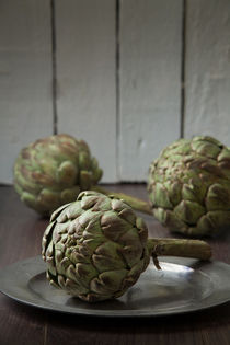 Artichokes in a rustic kitchen by Dave Milnes