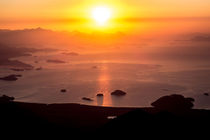 Sunrise over the ocean as seen from a mountain by Joao Henrique Couto e Silva