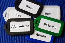 Luggage tags with refugee's nations von Christian Zirsky