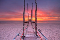 Seaside jetty at sunrise on Texel island, The Netherlands by Sara Winter