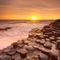 'The Giant's Causeway in Northern Ireland at sunset' by Sara Winter
