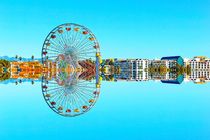 reflection ferris wheel with buildings and blue sky by timla