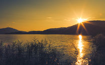 Sun star over lake - Sonnenstern über dem Wörthersee by Silvia Eder