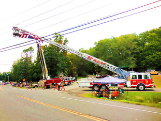 A-firetruck-ladder-the-is-fully-extenden-into-the-sky