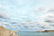 Port of Ostuni, blue sea, sky and white clouds, Apulia, Italy by Tania Lerro
