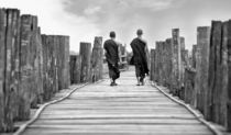 Monks on a bridge by Manuel Bruque