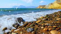 Coastal pebbles and sea spray by Yuri Hope
