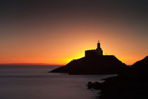 Golden sunrise over Mumbles lighthouse by Leighton Collins