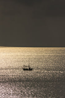 lonely fisherboat and golden reflections by anando arnold