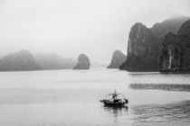 Halong bay islands in the morning mist by anando arnold