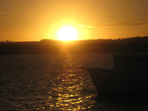 Boat in golden sunset by Ro Mokka