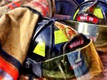 Two Fire Helmets And Fireman's Jacket by Susan Savad