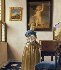 A Young Woman Standing at a Virginal von Jan Vermeer
