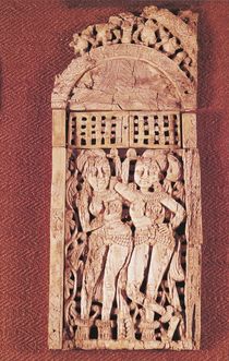 Carved Indian plaque depicting two female figures under a torana by Afghan School