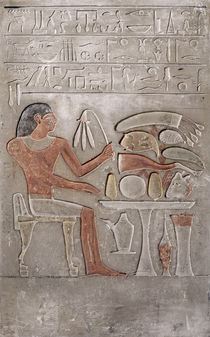 Stela depicting the deceased before an offering table by Egyptian
