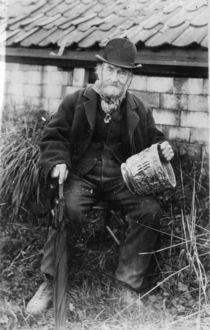 Edward Bingham holding one of his Castle Hedingham Ware designs by English Photographer