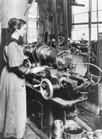 Woman working at internal thread milling machine by American Photographer