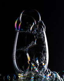 glass with bubbles on black 1 by Tim Seward
