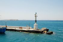 Small lighthouse among the Cycladic Islands by Yuri Hope