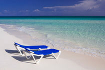 Caribbean beach with canvas chairs in Cuba by Bastian Linder