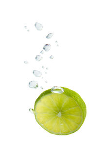 Lime in water with air bubbles by Bastian Linder