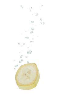 Banana in water with air bubbles by Bastian Linder