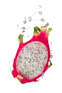 Dragon fruit in water with air bubbles by Bastian Linder