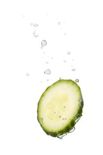 Cucumber in water with air bubbles by Bastian Linder