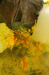 Crystal of sulfur in mine inside Ijen volcano by Bastian Linder