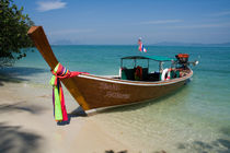 Long tail boat on Koh Naka island, Phuket, Thailand by Kevin Hellon