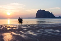 Long tail boat on Pak Meng beach, Trang province, Thailand at sunset by Kevin Hellon