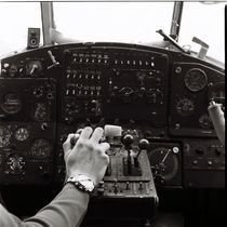 A man at the helm of an old plane by Kiryl Kaveryn