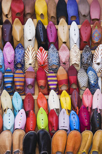 Displayed shoes in a shop in the souks of Marrakesh Morocco. by Danita Delimont