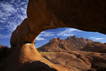Natural rock arch at Spitzkoppe, and Pondok Mountains in dis... by Danita Delimont