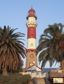 The lighthouse is a prominent landmark of the seaside town o... by Danita Delimont