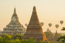 Bagan. Hot air balloons rising over the temples of Bagan. by Danita Delimont