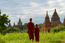 Monks with ancient temples and pagodas, Bagan, Mandalay Regi... by Danita Delimont