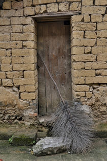 Old Doorway, Traditional village of Xingping with broom in front by Danita Delimont