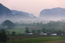 Limestone hill, farming land and village house in morning mi... by Danita Delimont