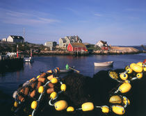 Canada, Nova Scotia, Peggy's Cove, Fishing nets and houses at harbor by Danita Delimont